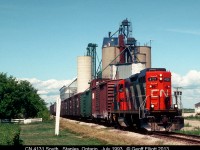 CN 4131 leads the "Leamington Flyer" south through Staples, Ontario on a hot July afternoon.  Lots of business on the train today with plenty of CN insulated boxcars for Heinz, a couple covered hoppers for either the Blytheswood or Staples Co-ops.  Up front are an NS and CP boxcar that are probably destined to one of the industries on former C&O in Leamington, more than likely Bennie Lumber.  Sadly nothing remains of railroads in this general area now with the CASO having been lifted this past Spring.
