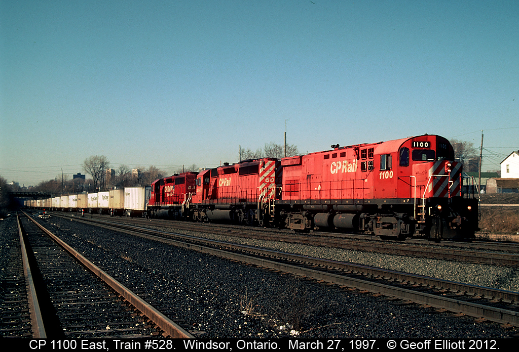 CP Roadrailer train #528 comes up out of "the tube" @ Windsor South back in March of 1997. Train has CP 'Bouncing Bertha' #1100 on the point, and is a little over powered with 2 SD40-2's to pull this very light train through to Toronto!!