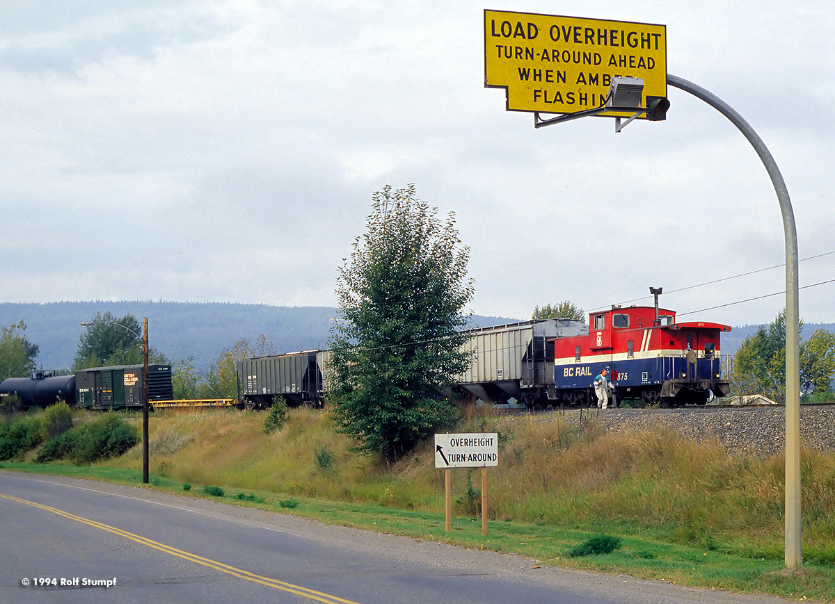 The conductor of a southbound BC Rail freight throws the switch before jumping on the caboose while the train is leaving Quesnel.