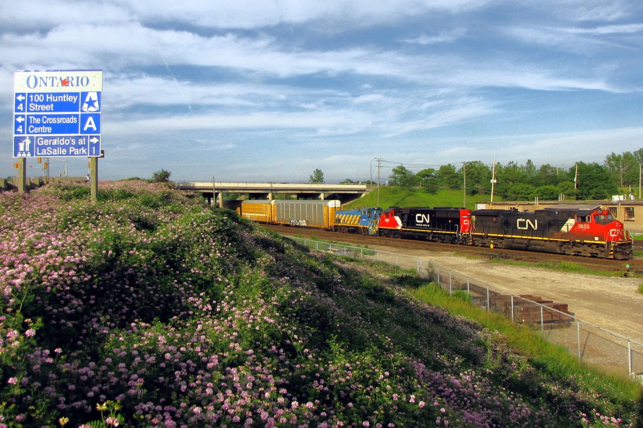 A nice treat and the longest day of the year shows Port of Montreal MP15 on route to have a liitle work done on here.