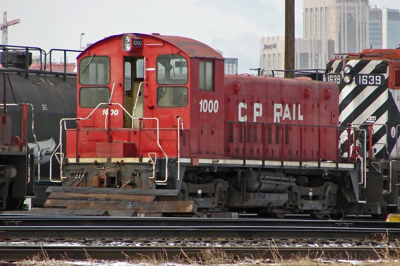 CP "Daughter" or "slug" unit # 1000 (ex SOO SW1200) withdrawn in December 2010 is theoretically still active in Alyth Yard in 2007 but looks rather blocked in with lumber and not very movable.