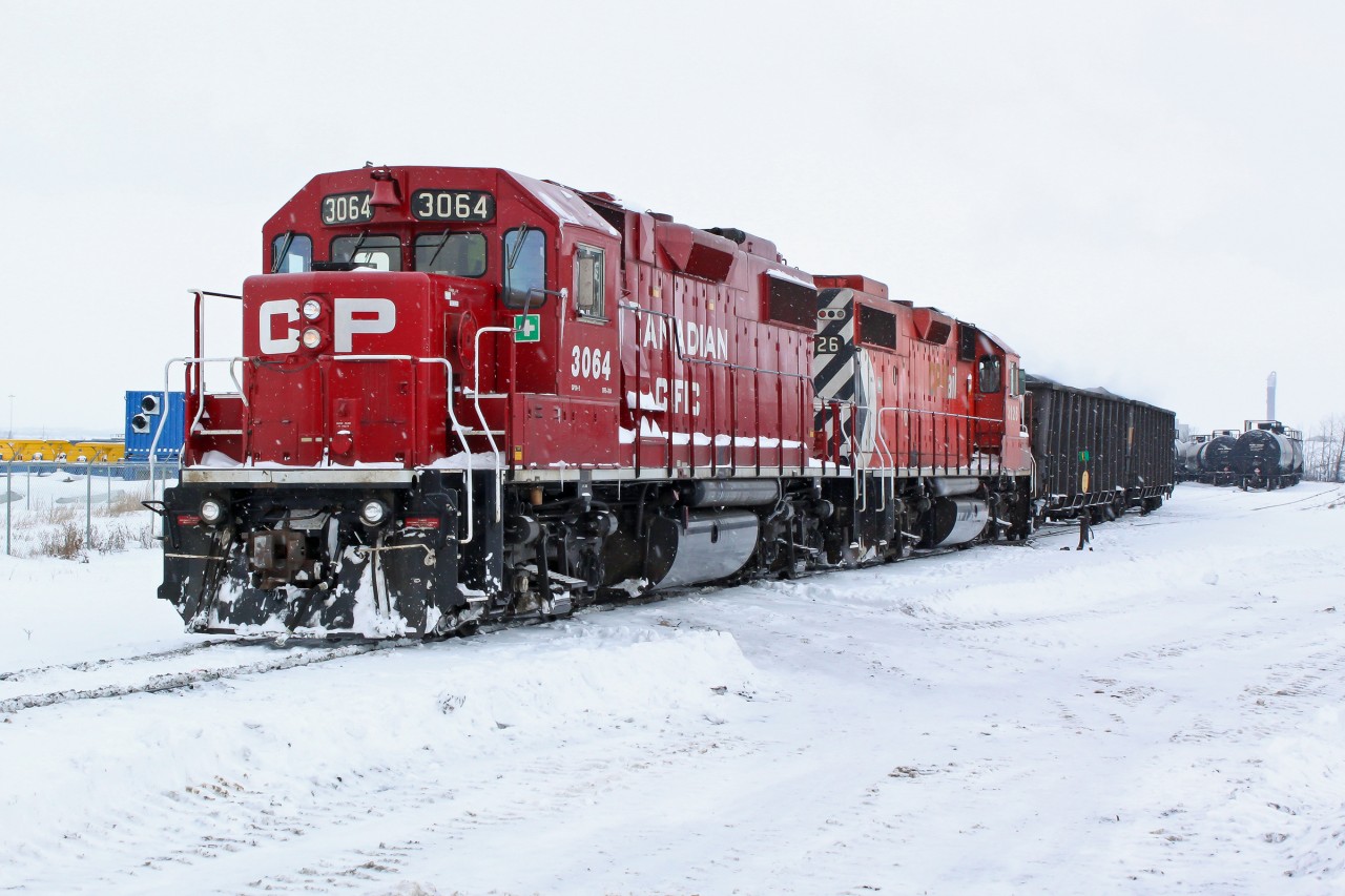 GP38-2's CP 3064 and 3125 switching in wintry conditions