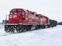 GP38-2's CP 3064 and 3125 switching in wintry conditions