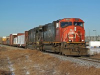 SD70I CN 5637 and SD70 IC 1011 head south on the Camrose Sub.