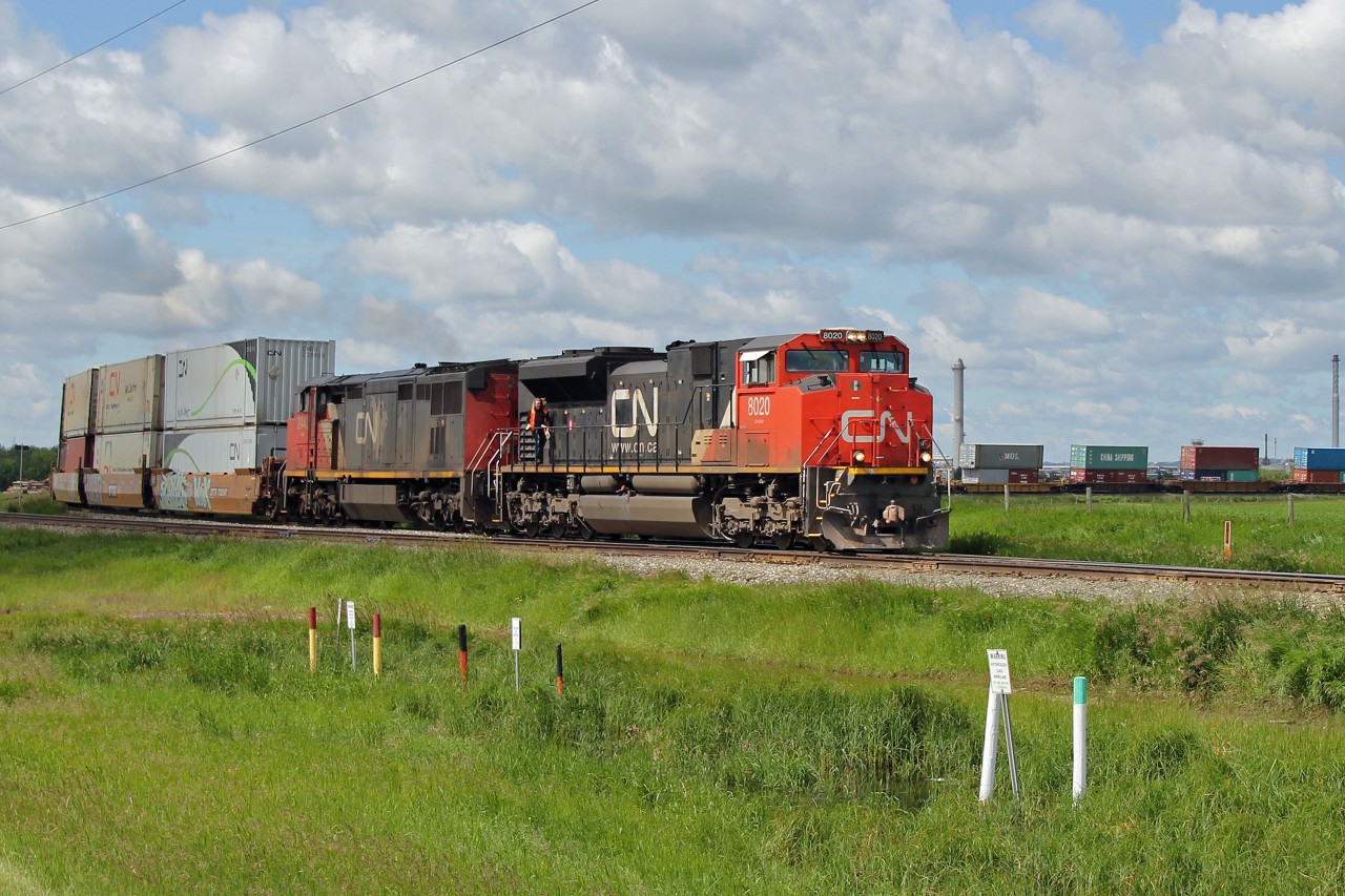 SD70m-2 8020 and DASH 8-40CM 2440 round the curve at Harris junction approaching Scotford Yard.  This intermodal would normally run east on the Wainwright sub but was the third such train this morning to be diverted over the more northerly Vegreville sub.  Reason unknown.