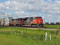 SD70m-2 8020 and DASH 8-40CM 2440 round the curve at Harris junction approaching Scotford Yard.  This intermodal would normally run east on the Wainwright sub but was the third such train this morning to be diverted over the more northerly Vegreville sub.  Reason unknown.