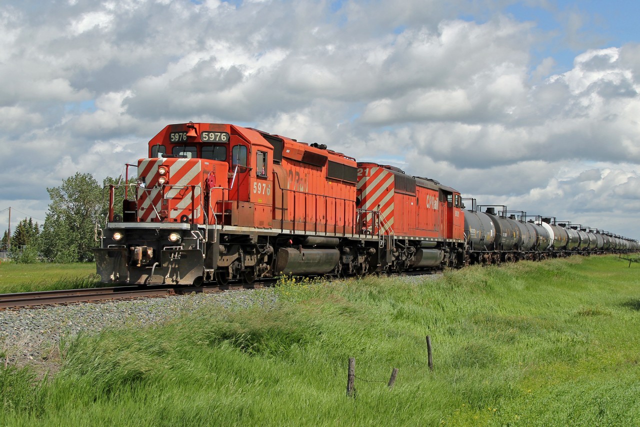SD40-2 CP 5976 and 40-2F "Red Barn" 9021 are seen at Josephburg heading a short rake of tank cars south from Elk Island to Clover Bar on CP's Scotford Sub.
