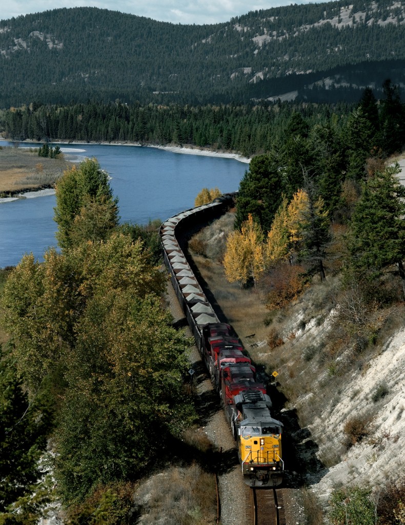 CP train 268 UP-Eastport Idaho to Lethbridge, with power off the joint CP-UP Hinkle Ore to Lethbridge run through pool, heads eastward from Cranbrook to the Crow along the Kootenay River.