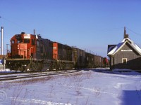 CN 5506 and 5010 with train 435 pass the old Tecumseh station enroute to the Boat Yard in Windsor. The Tecumseh station was built in 1854 and was the telegraph and post office and later had the only telephone in town.  It was used to transport tanks, trucks, and jeeps in WWII. The station was used until 1967 and was moved to the nearby Canadian Transportation Museum and Heritage Village in 1976. 