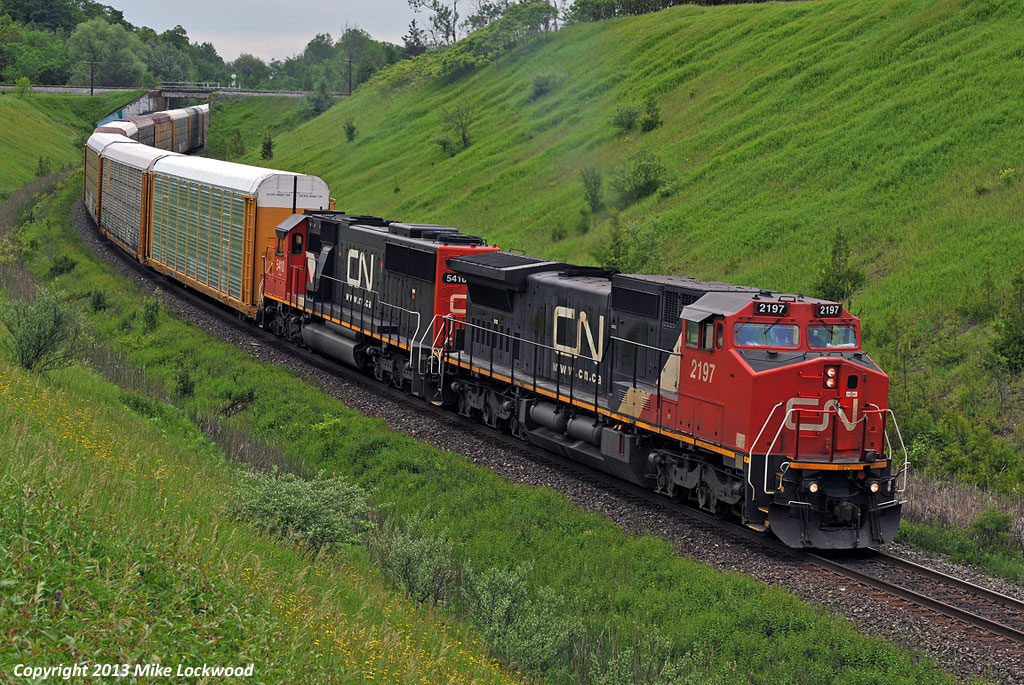 "We all started as something else". Former Santa Fe and Oakway Leasing units, now CN 2197 and 5410 respectively, lead 373's train up the York Sub and under CP at Beare. Thanks for the heads-up, Delic. 1252hrs.