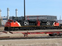 More BIT action, this time featuring the newest in stylish mainline freight power (at the time): shiny CN SD70M-2 units 8807 and 8824 work the north end of the Brampton Intermodal Terminal, with just-arrived intermodal hotshot #148. In the background, the natural-gas fuelled Goreway Power Station is being constructed off Goreway Drive, its large emissions stacks already erected.
