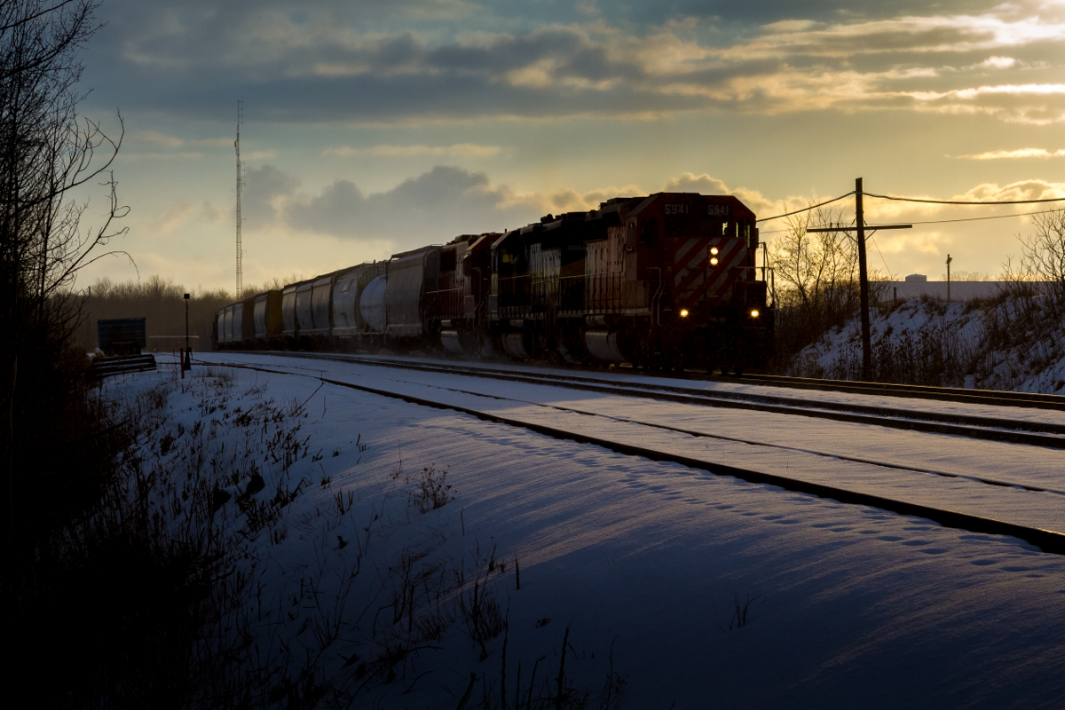 As a Winter day comes to a close, a trio of EMD products are about to throttle up with train 242 after working the OSR Yard at Guelph Junction.