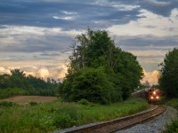 Big train under a bigger sky.