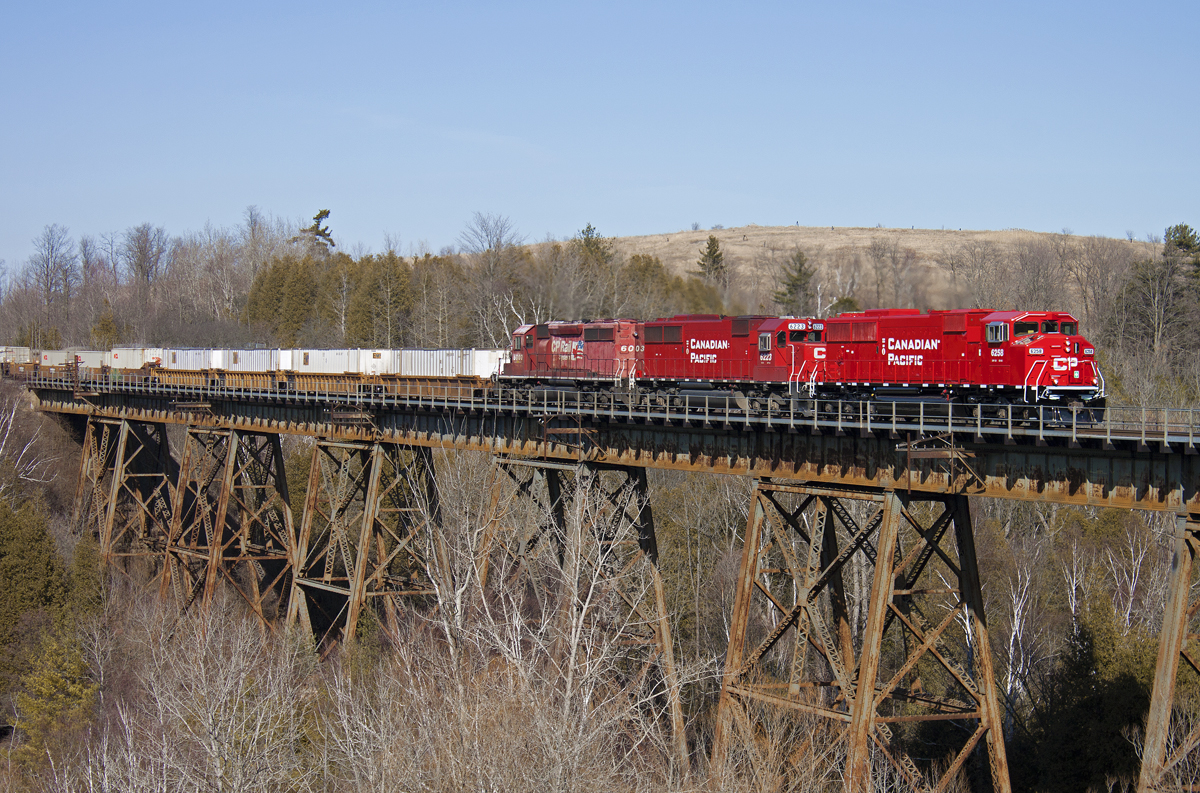 With the recent news of the CP SD60's being stored and put up for sale, I figured I would upload my favourite shot of one. Here's 6258, fresh out of CAD on it's only run through Ontario, over the Cherrywood trestle.