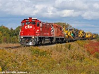 CP 2100 and 8252 lead a very unprofitable Cobourg Turn westbound along the Belleville Sub. Ironic that this ancient GP9 has managed to outlive the much newer Genset, at least in CP's fleet. 1428hrs.