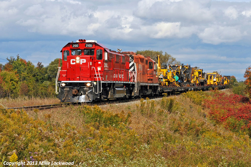 CP 2100 and 8252 lead a very unprofitable Cobourg Turn westbound along the Belleville Sub. Ironic that this ancient GP9 has managed to outlive the much newer Genset, at least in CP's fleet. 1428hrs.
