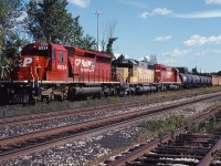 CP 6034, HLCX 4057 and CP 783 sit at Burlington GO station awaiting permission to travel westward to home rails.  Colourful lash ups were common on the CP Rail of the mid-ninties, and today was no exception!