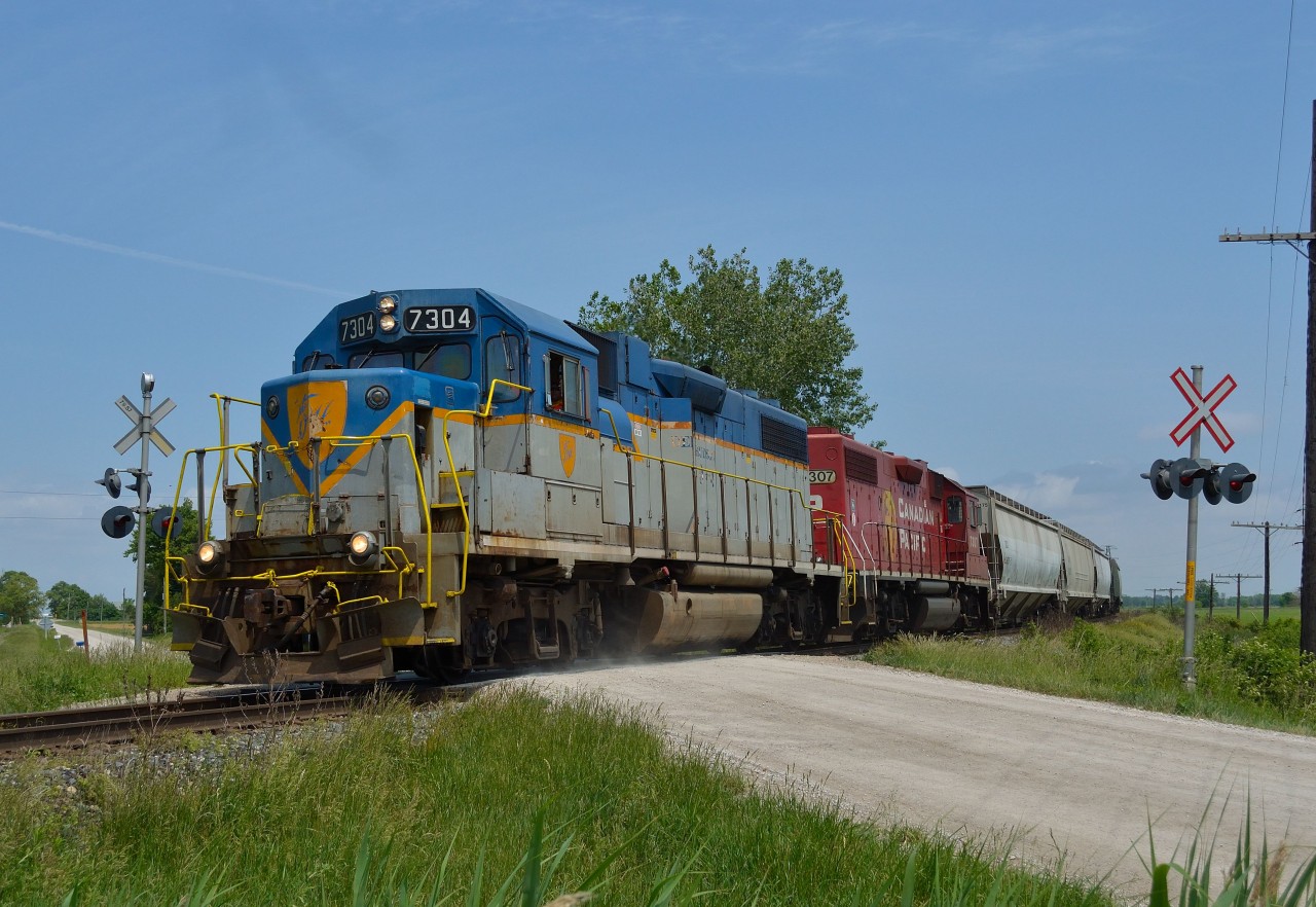 With D&H 7304 on the point, CP T29 (formerly T76) passes the Mint Line crossing as it approaches the east switch at Tilbury on its way towards Walkerville.