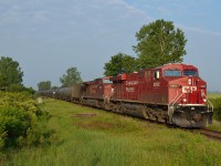 CP 608 heads eastbound on the approach to the Ringold Diamond with 80 loads of crude oil. This is one of the reroutes due to the trestle collapse near Sudbury.