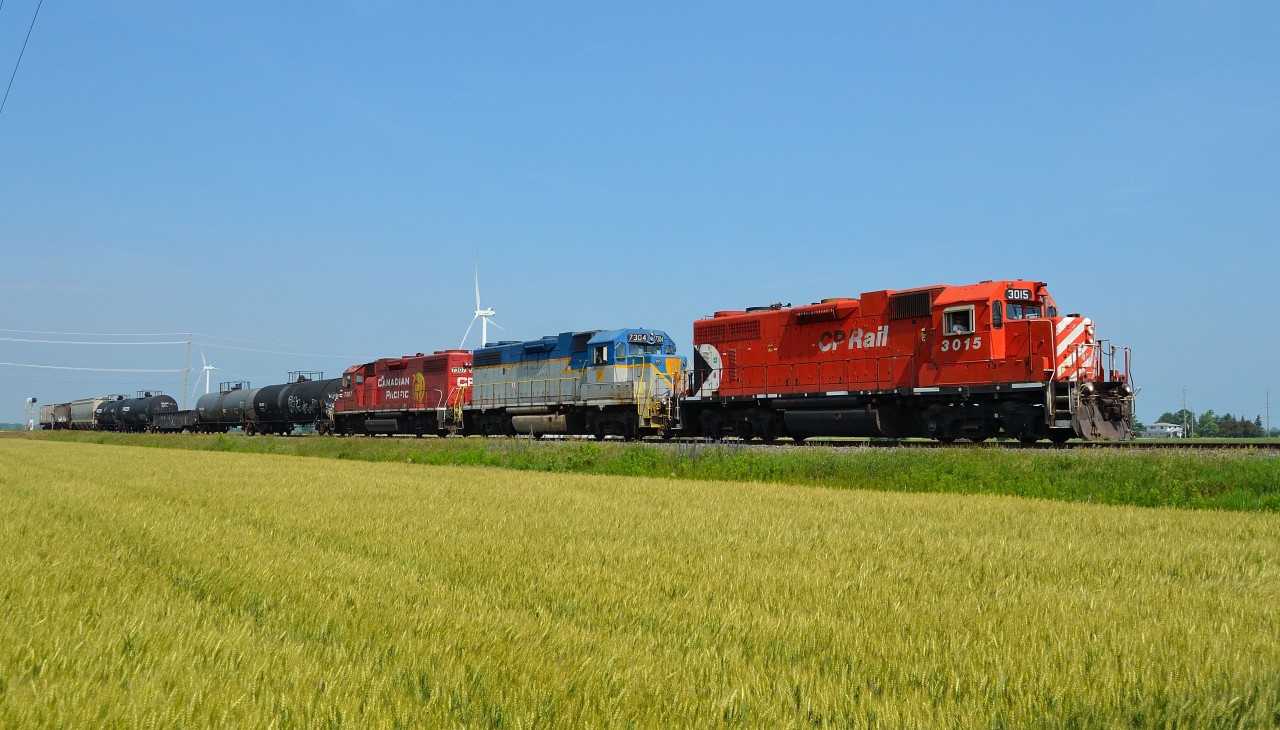CP T29 heads eastbound thru Haycroft with a trio of GP 38-2's