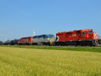 CP T29 heads eastbound thru Haycroft with a trio of GP 38's