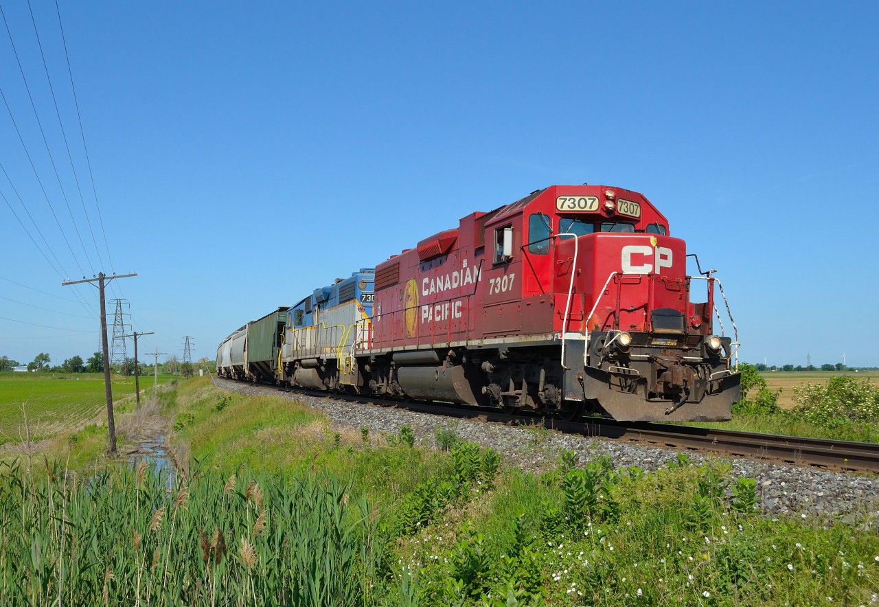 CP T29 heads eastbound around the bend in Tilbury after passing 243 that was waiting in the siding.