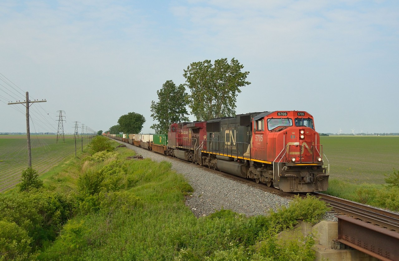 Something you don't see everyday, CP 240 heads eastbound thru Jeannette mile with CN 5705 on the point.