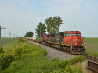 Something you don't see everyday, CP 240 heads eastbound thru Jeannette mile with CN 5705 on the point.