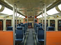 An afternoon commute wouldn't be complete with a ride on a late 80's orange bilevel passenger car. Built by the Urban Transportation Development Corporation (previously by Hawker Siddeley, now Bombardier) in 1988/89, GO Transit 2337 is still racking up the miles in her near-original interior decor, seen here empty before departing Toronto Union Station on afternoon train #263 to Bramalea. The photographer notes he would then take a seat near the front on the right, and enjoy the 35 minute trip home.
<br><br>
Fast forward a number of years, and an ongoing rebuilding/refurbishing program has updated most of GO Transits' older cars such as 2337 to a more modern look, with all of the screamin' orange panels and light blue vinyl seats replaced with subtle grey and deep blue fabric.