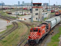 [Editors note: C yard tracks pictured are to be removed in 2013] Canadian Pacific GP9u #1610 & slug #1023 with a cut of covered hoppers at CP's Agincourt Yard. Toronto, ON. For more pics & video from my collection see <a href="http://northamericabyrail.info"> http://northamericabyrail.info </a>
