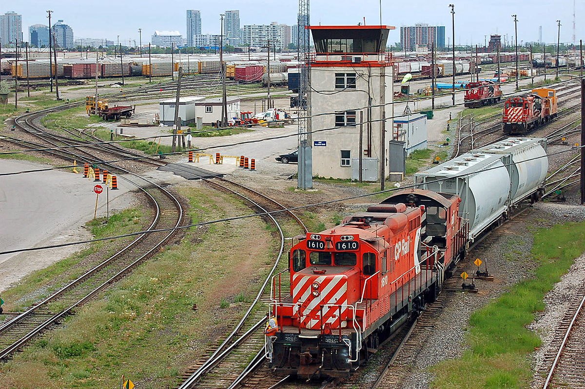 Canadian Pacific GP9u #1610 & slug #1023 with a cut of covered hoppers at CP's Agincourt Yard. Toronto, ON. For more pics & video from my collection see  http://northamericabyrail.info