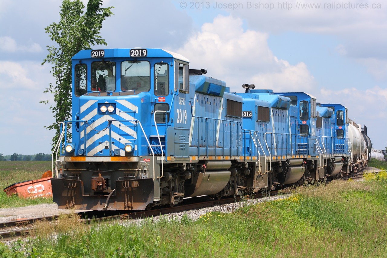 On a lovely June afternoon the Nanticoke Road Switcher works the Southern Ontario Railway's yard at Garnet Ontario.  They were building their train to head to the Imperial Oil plant in Nanticoke.