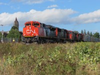   Out of the brush and into the sunlight,  CN train A407 charges up a small grade with 4 locos in tow along with a fair sized train from Dartmouth, NS and Truro, NS.  
