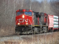 With a POTASHCORP hopper in tow, the daily manifest freight from Moncton's Gordon yard to Saint John's Island Yard is beginning to blow for the crossing at Ontario Drive mp 7.89 Sussex Subdivision.