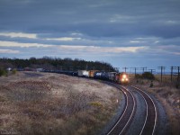 CN #369 from Chambord, Québec flies westbound through Lovekin bound for Toronto under darkening skies.
