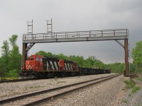 CN GP9rm #4139 and #4136 are seen leaving Feeder Yard with 30+ cars as a storm rolls in from the south. One of the longest trains I have even seen pulled out of that yard.