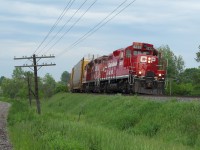 Two GP9u's lead the Pender Job through the small community of Innerkip. 