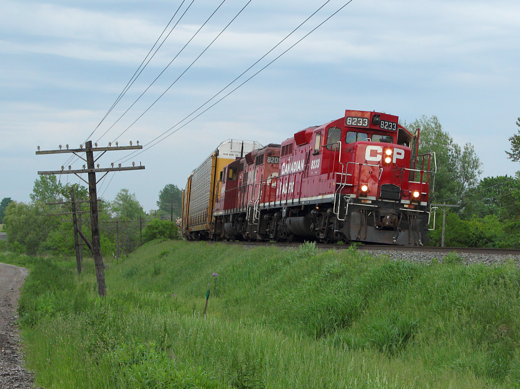 Two GP9u's lead the Pender Job through the small community of Innerkip.