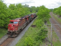 CP and CN. CP train 641 approaches Lobo on CP's Windsor Sub with a CP-CN GE duo. The trailing CN GEVO is so close yet so far from home territory as to the right is CN's Strahtroy Sub.