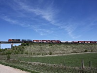 CN 403 with a CN and IC units are about cross the trestle at Rivers Manitoba.