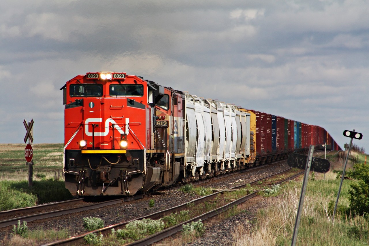 CN 8023 and BCOL 4612 with a long 347 climb over the grade at Kitella as it holds for an outbound crew to get to Watrous Sk.