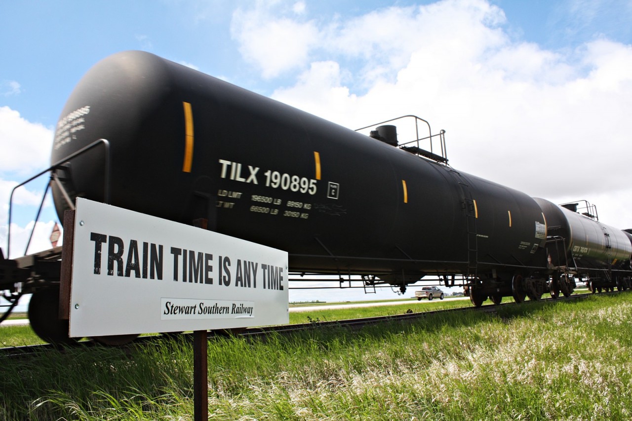 The sign says it all as SSR oil empties head to the crescent point facility at Stoughton Saskatchewan. I caught this train on the way to Regina and then Watrous to work. I always wanted to get a train going by one of these signs it was just luck it happened to be this sign.
