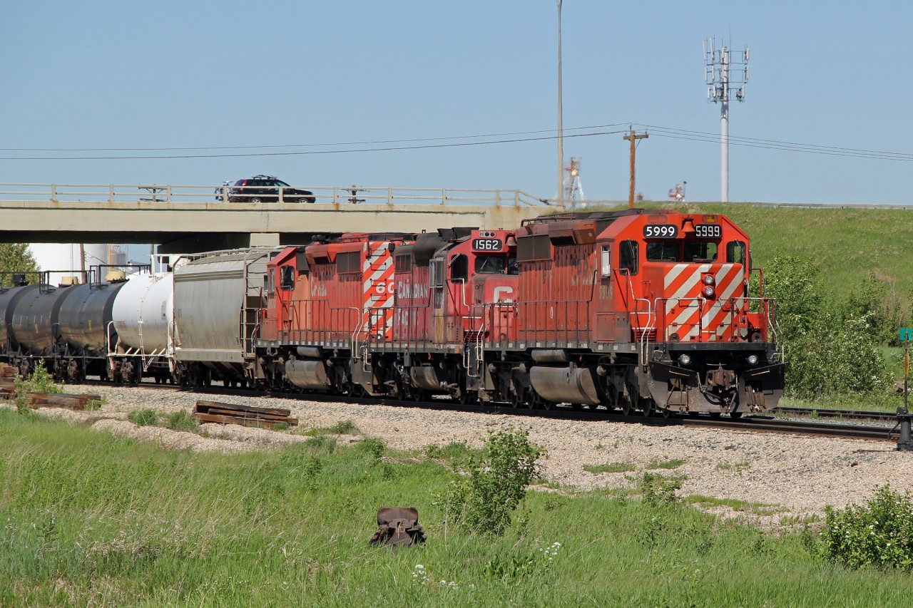 SD40-2's CP 5999 and 6033 bracket GP9 1562 as they head a transfer from CN's Clover Bar Yard back to the CP tracks of the Scotford Sub.
