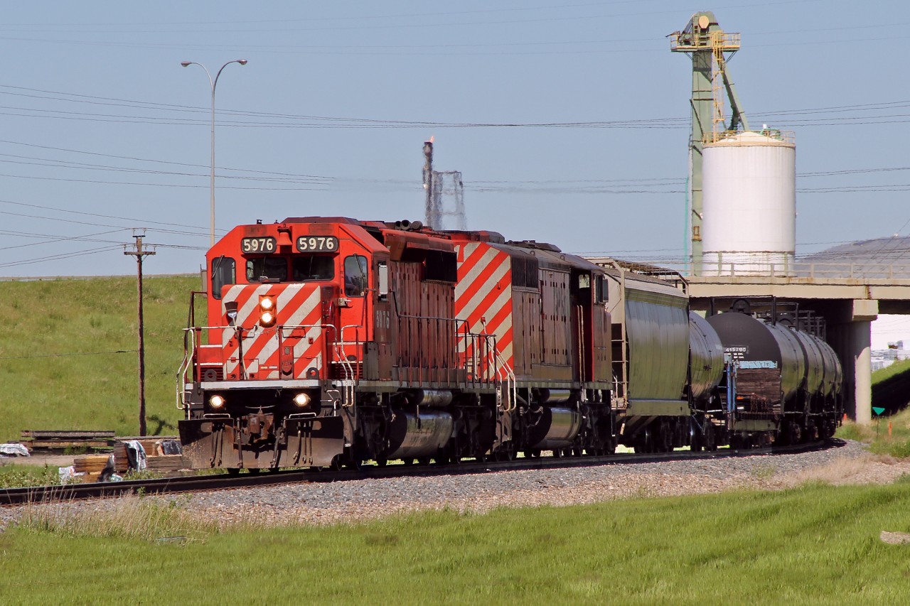 SD40-2 CP 5976 and SD40-2F "Red Barn" CP 9021 head south on teh CP Scotford Sub at East Edmonton.
