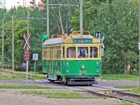 Edmonton Radial Railway Society ex Melbourne tram #930 crosses 104 street on route to Strathcona Station