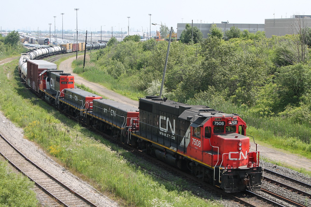 2 GP38-2's and 2 slugs push the "Hump"