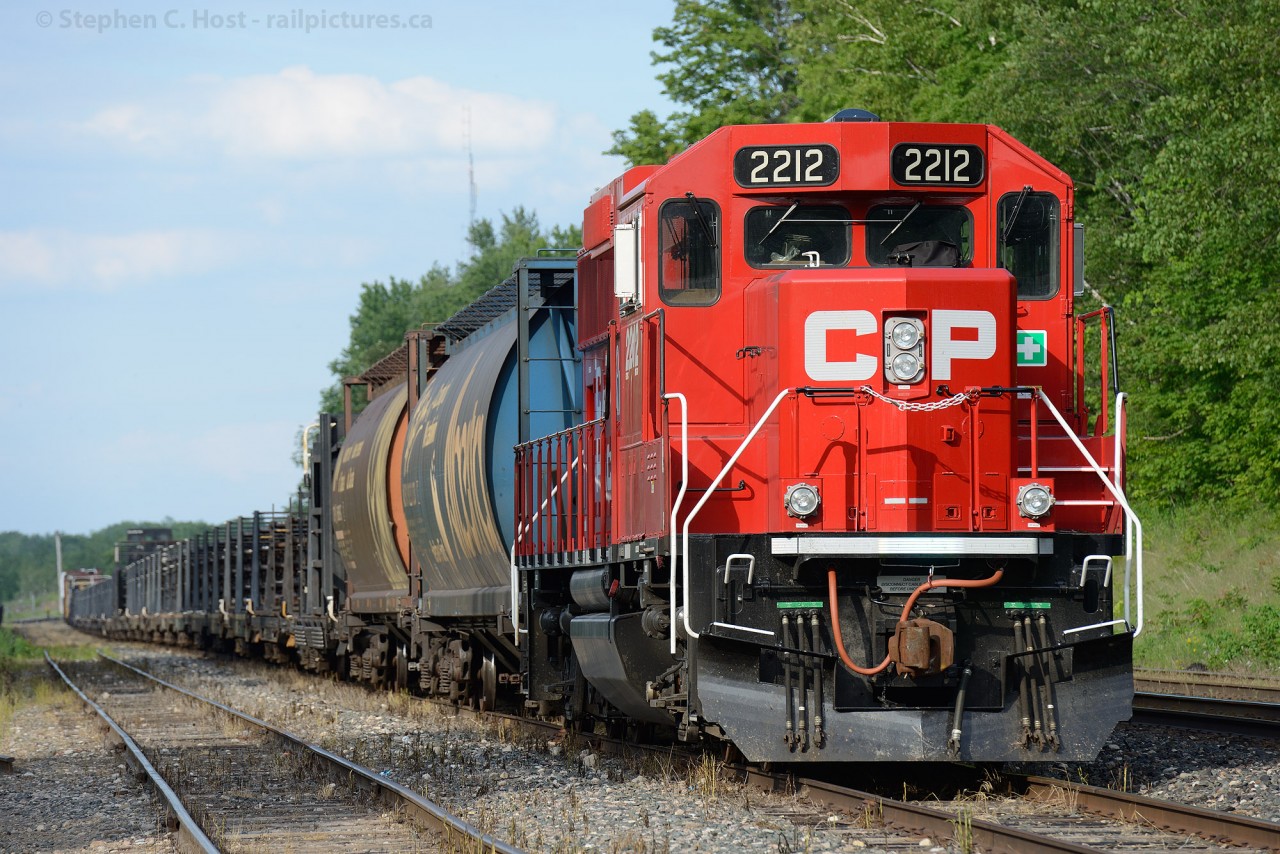 Brand new Canadian Pacific GP20C-ECO 2212, likely the first in Revenue Service in Canada sits at Guelph Junction on a work train as I telephoto in from the road to get this shot. Not exactly the kind of train you'd expect to see the latest and greatest assigned to, eh?
