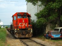 CN 4725 looks about as good as the car on the right as the crew of the Steel Train, Train 599 grab Tim Hortons before heading to Stelco Nanticoke via the CNR/SOR.