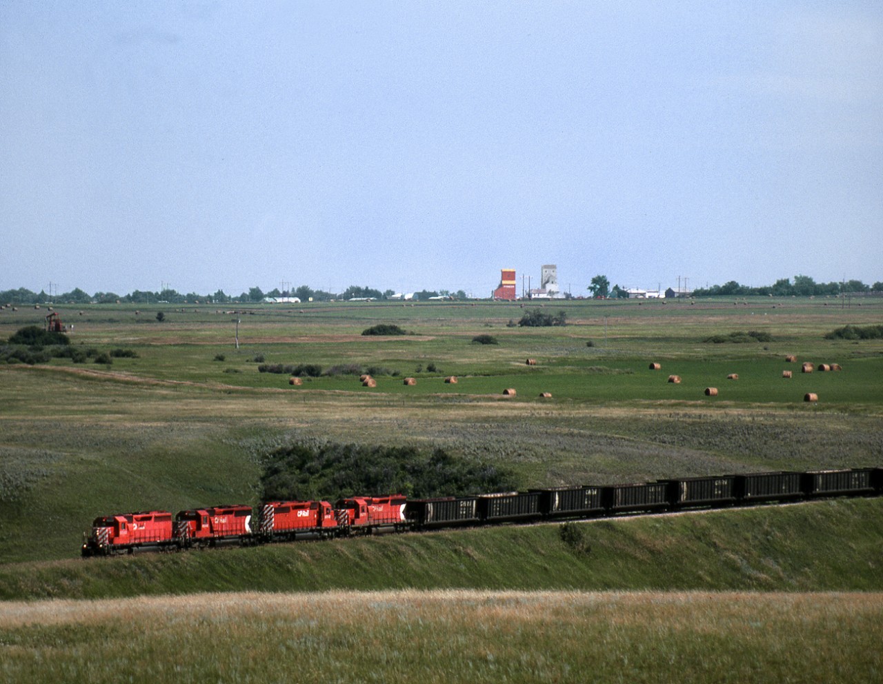 Westbound coal empties from Atikokan Ontario to Bienfait Saskatchewan cross the Moose Mountain Creek between Oxbow and Alameda. The construction of the Alameda dam required a diversion resulting in a tunnel under the wing of the dam near this location. Unit coal trains have long since ceased being replaced by oil trains from the Baaken formation.  The Bienfait coal mines still fuel 2 power plants near Estevan.