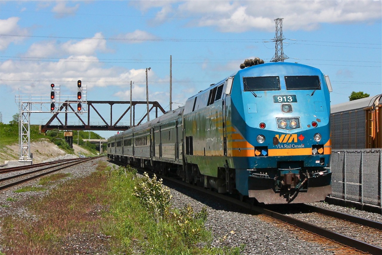 VIA 57 lead by P42DC 913 gives a blast of the horn for us as it rolls into Oshawa VIA/GO just moments after VIA 644 departed for Ottawa and a pair of CP GP9's worked the track in the background.